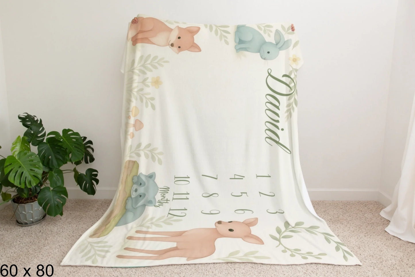 60x80_enchanted_forest_Man_Holding_Velveteen_Blanket_Mockup