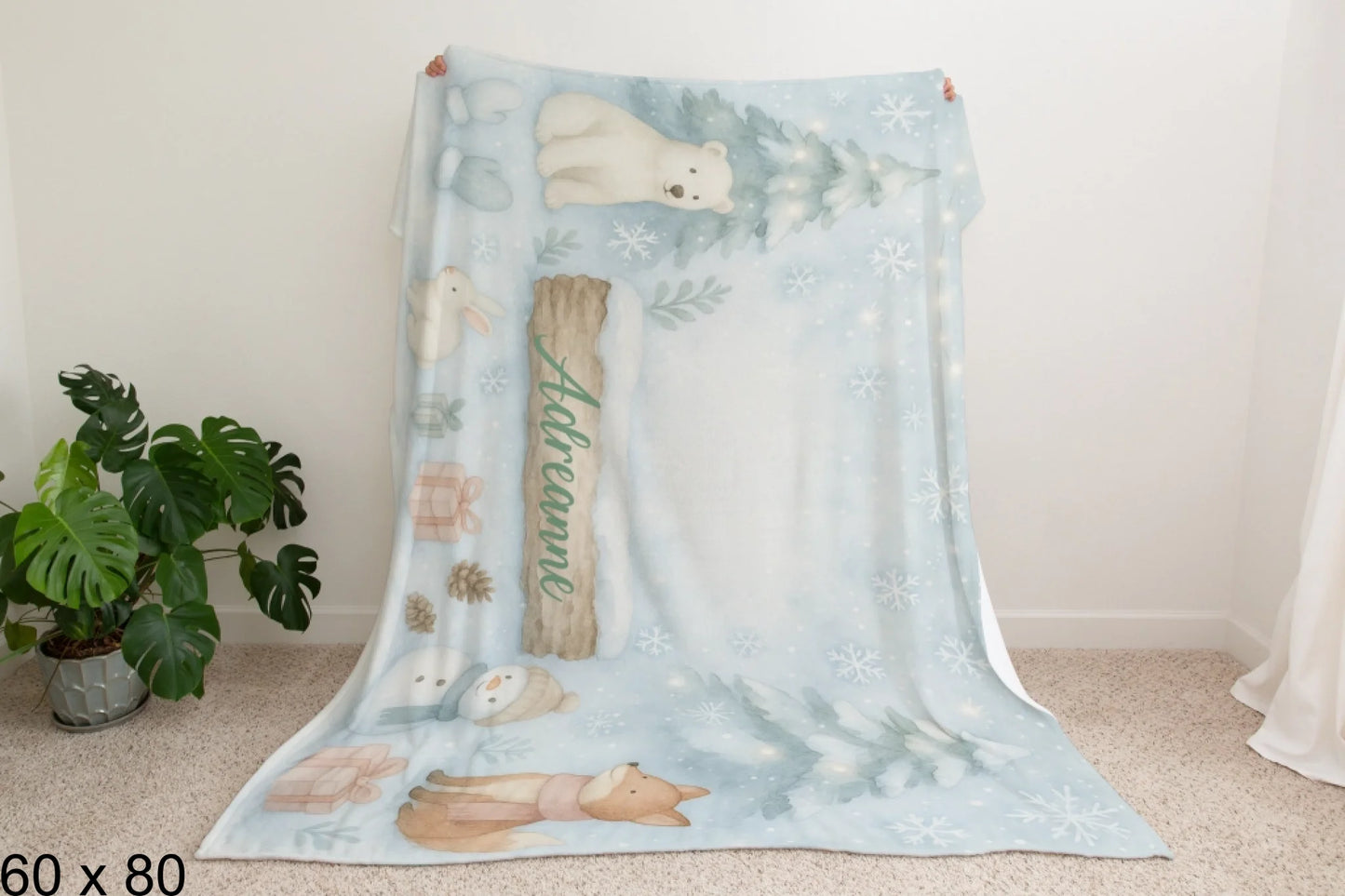 60x80_winter_wonderland_man_holding_velveteen_blanket_mockup