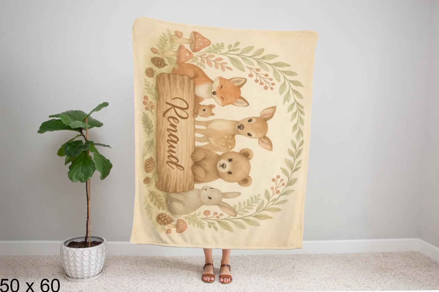 50x60_winter_wonderland_woman_holding_velveteen_blanket_mockup