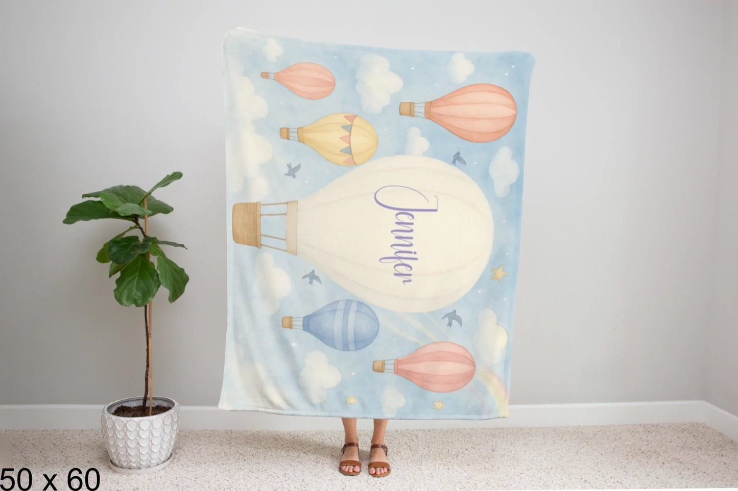50x60_winter_wonderland_woman_holding_velveteen_blanket_mockup