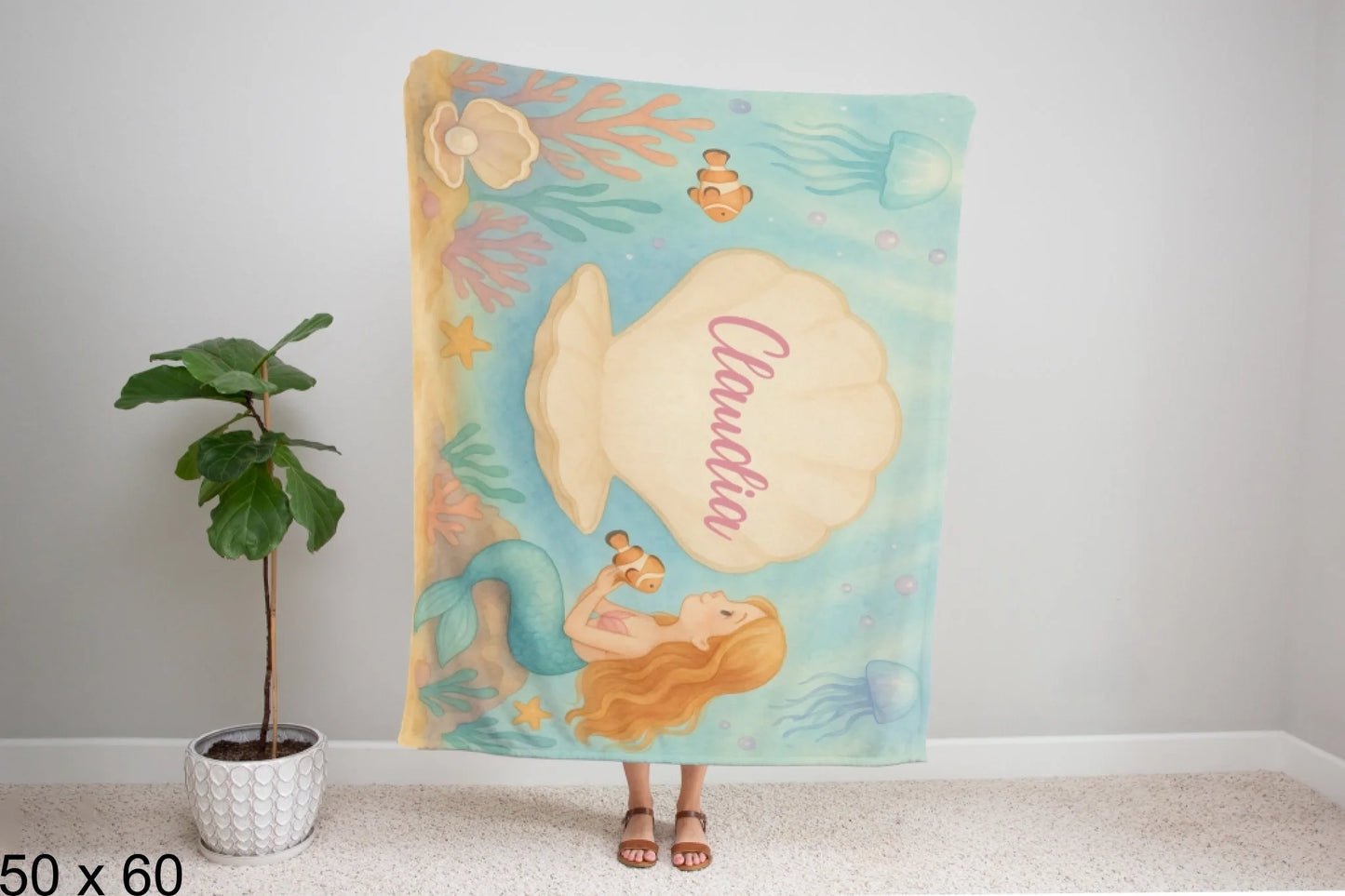 50x60_winter_wonderland_woman_holding_velveteen_blanket_mockup