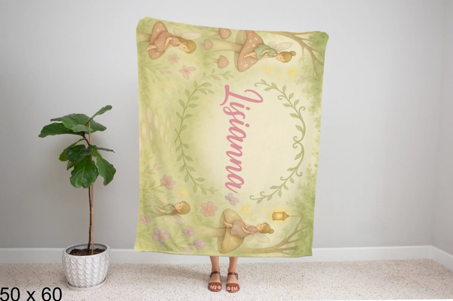 50x60_winter_wonderland_woman_holding_velveteen_blanket_mockup