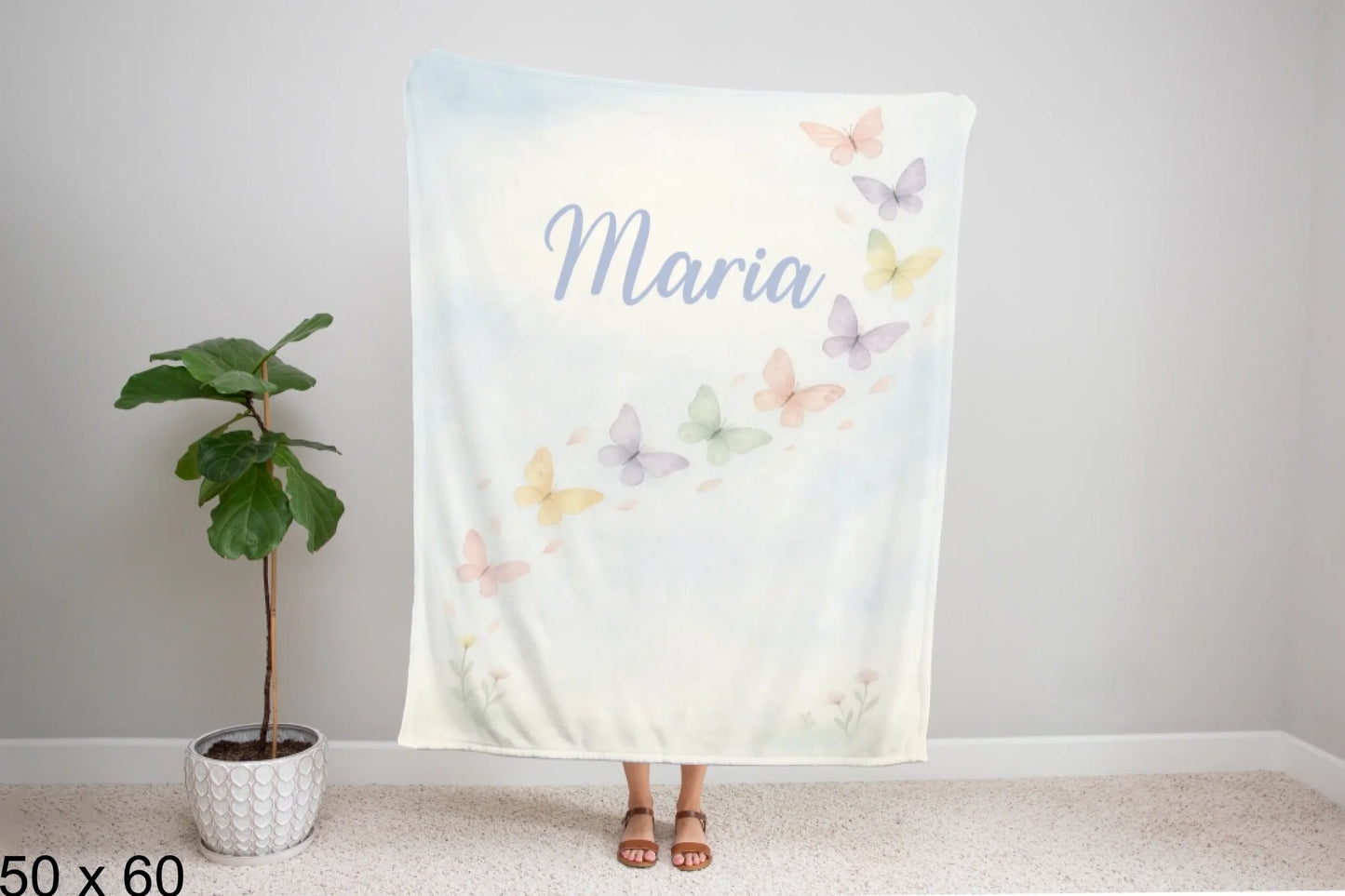 50x60_winter_wonderland_woman_holding_velveteen_blanket_mockup