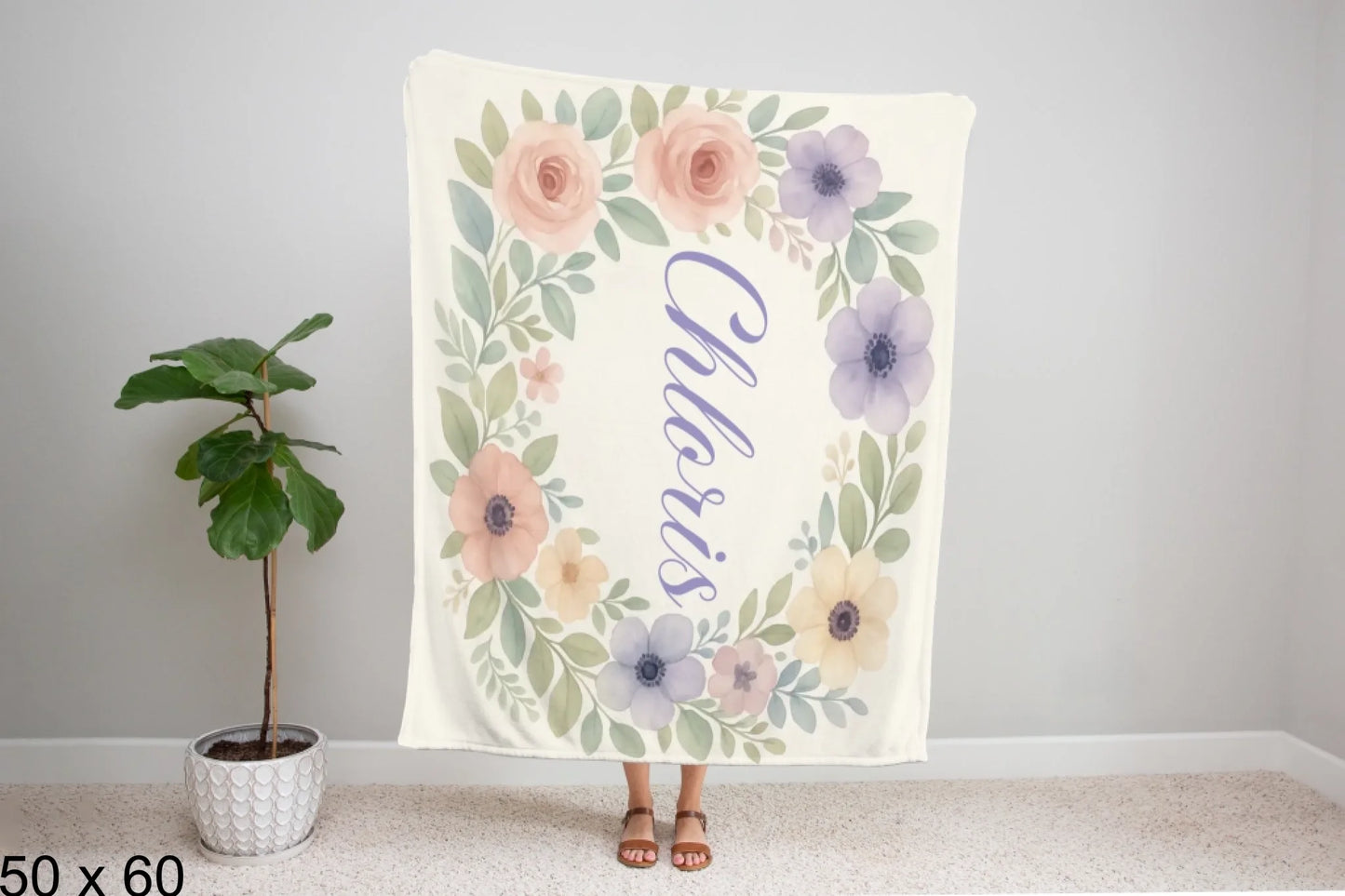 50x60_winter_wonderland_woman_holding_velveteen_blanket_mockup