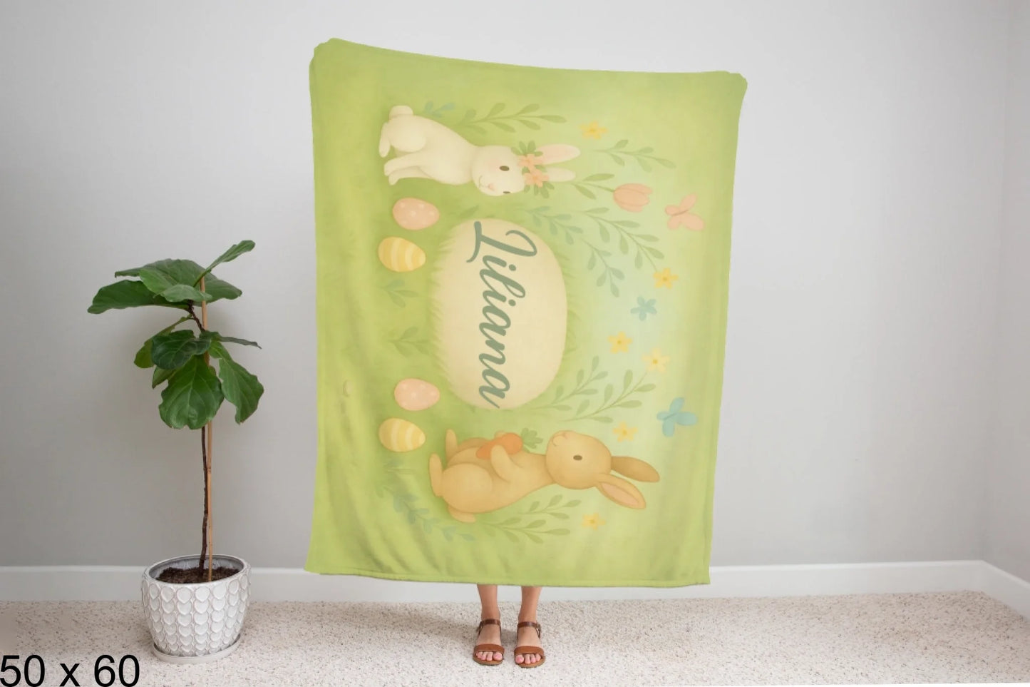 50x60_winter_wonderland_woman_holding_velveteen_blanket_mockup