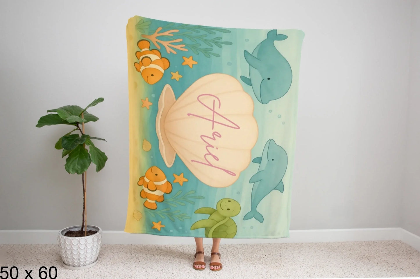 50x60_winter_wonderland_woman_holding_velveteen_blanket_mockup