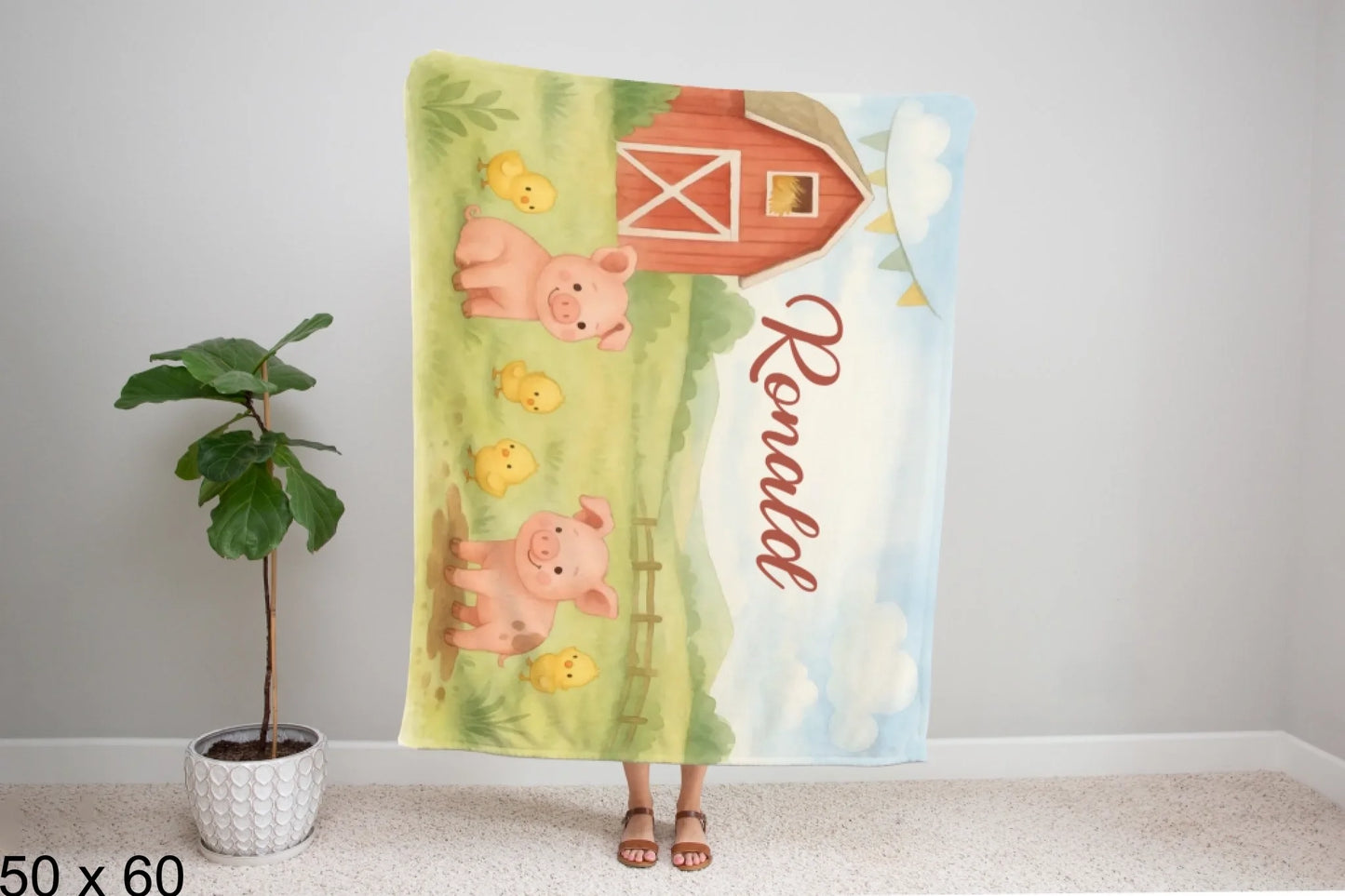50x60_winter_wonderland_woman_holding_velveteen_blanket_mockup