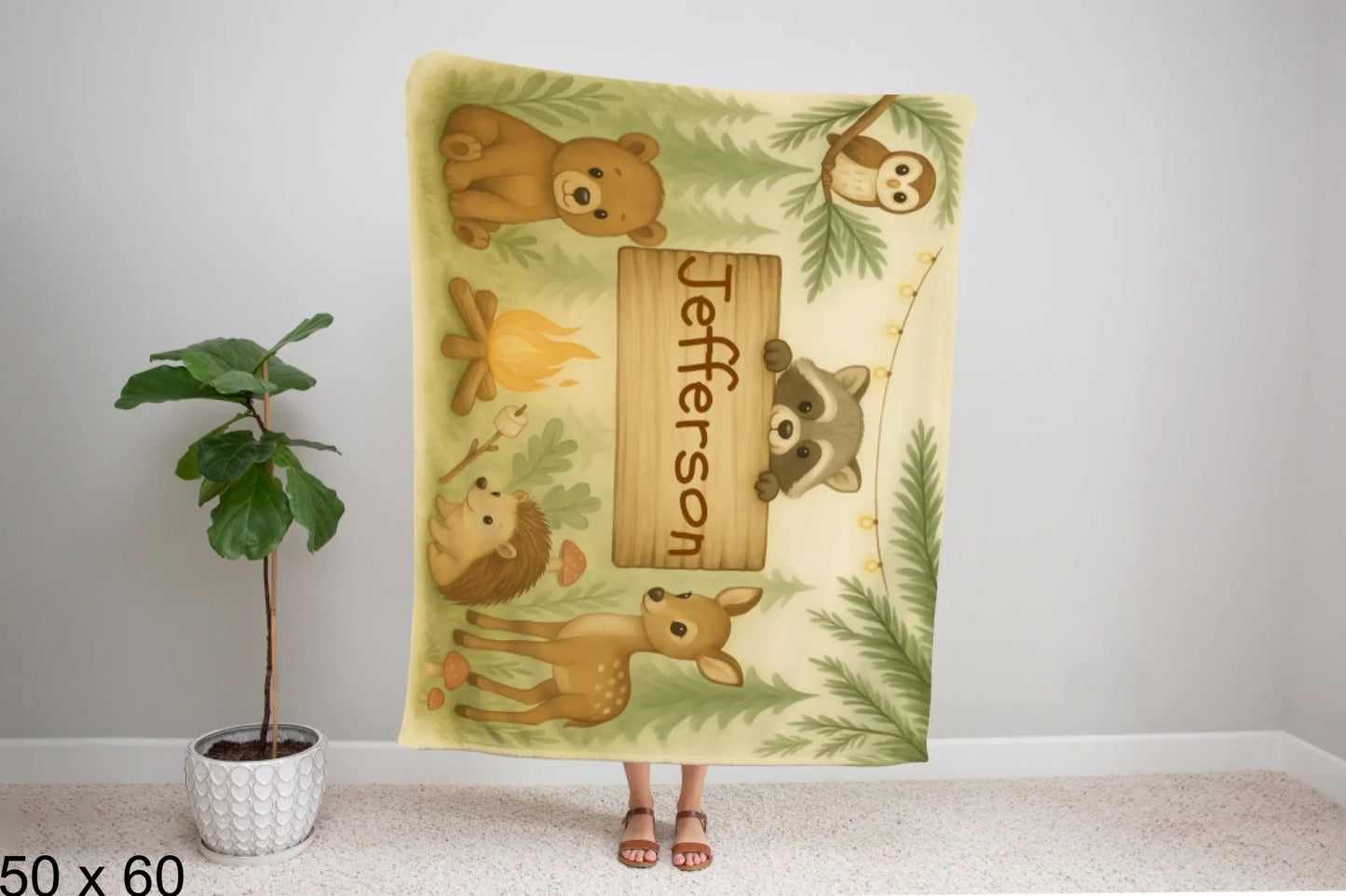 50x60_winter_wonderland_woman_holding_velveteen_blanket_mockup