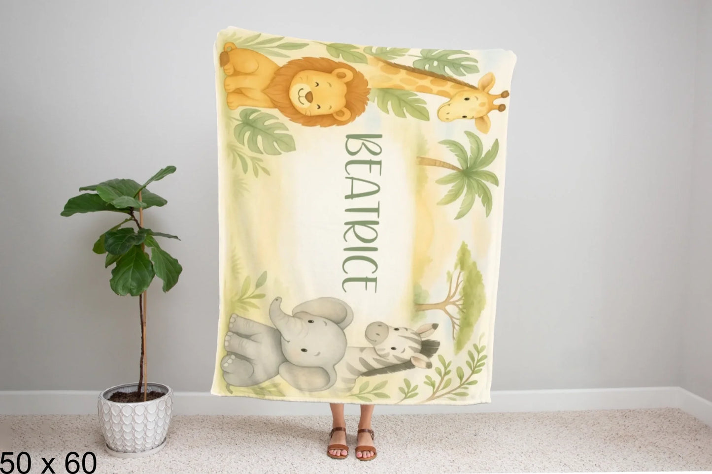 50x60_winter_wonderland_woman_holding_velveteen_blanket_mockup