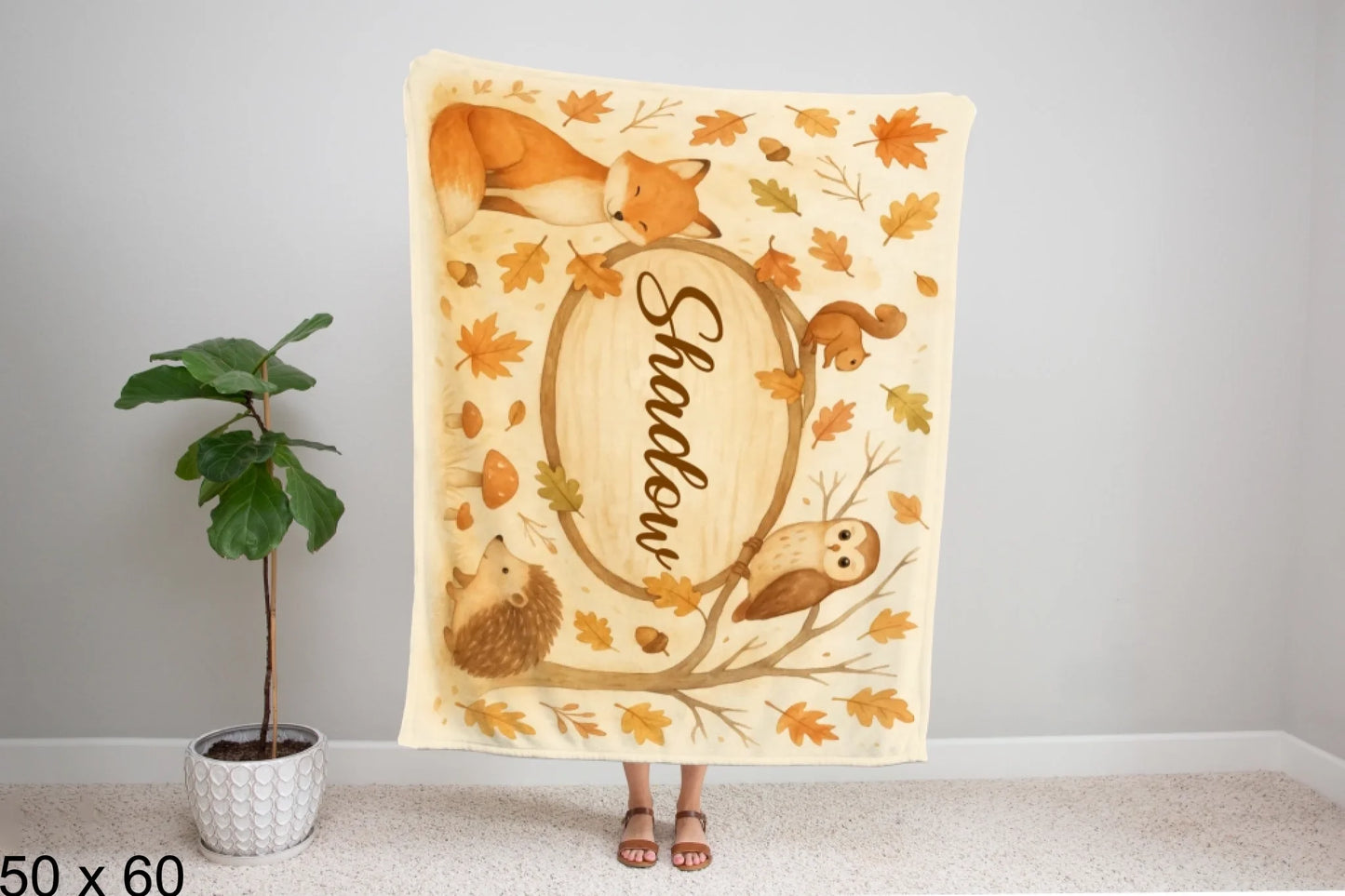 50x60_winter_wonderland_woman_holding_velveteen_blanket_mockup