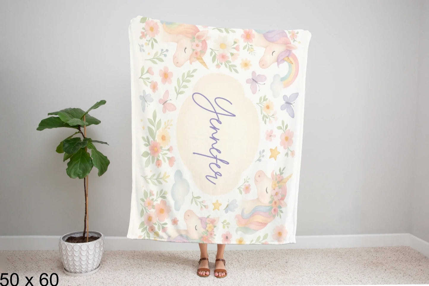 50x60_winter_wonderland_woman_holding_velveteen_blanket_mockup