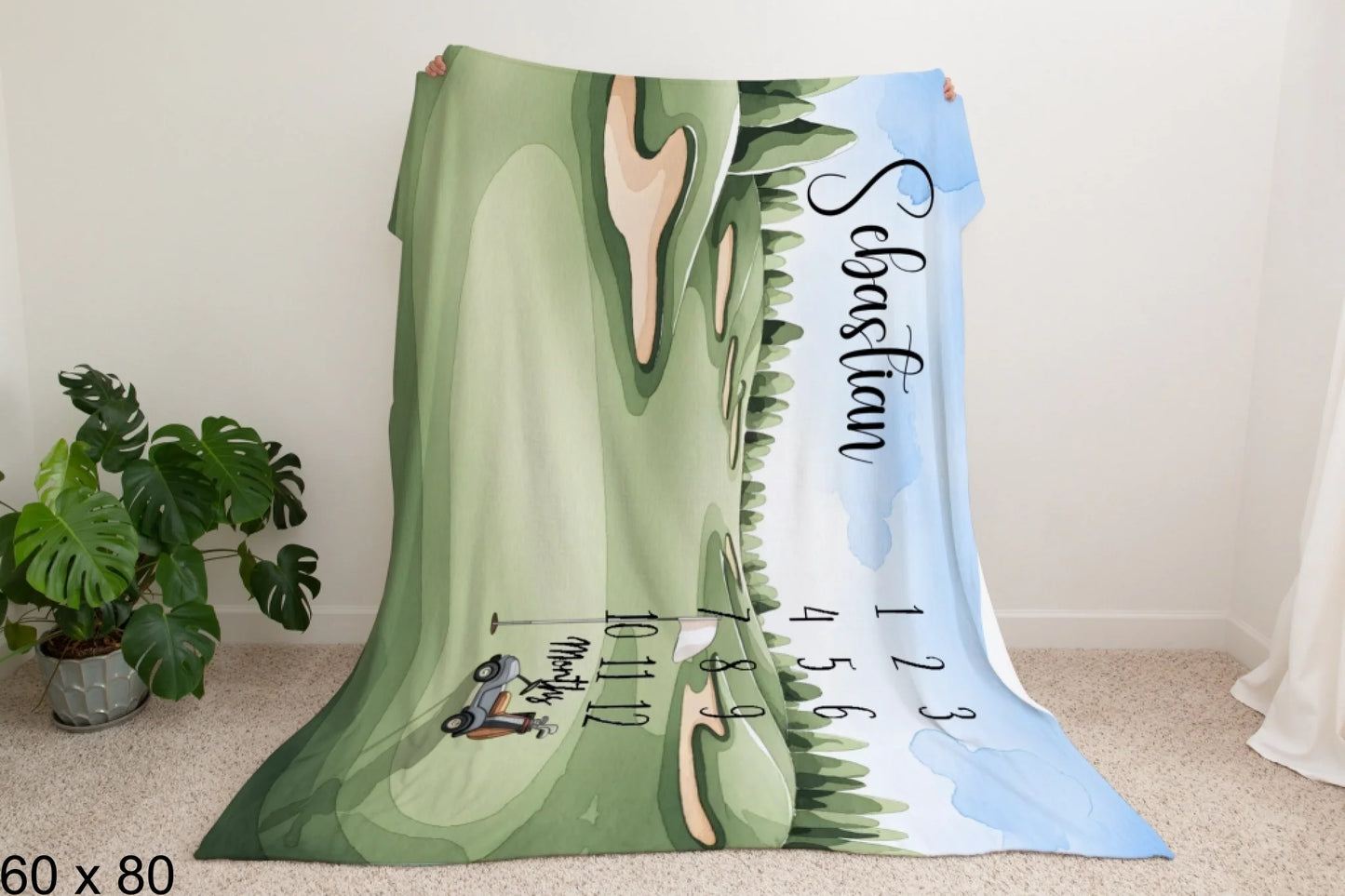 60x80_enchanted_forest_Man_Holding_Velveteen_Blanket_Mockup