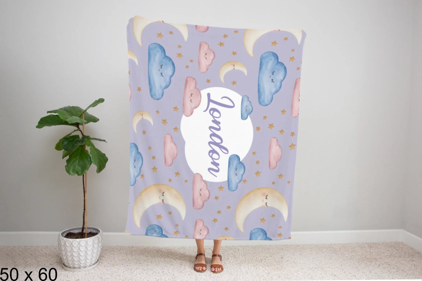 50x60_winter_wonderland_woman_holding_velveteen_blanket_mockup