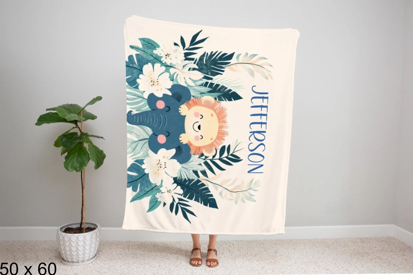 50x60_winter_wonderland_woman_holding_velveteen_blanket_mockup