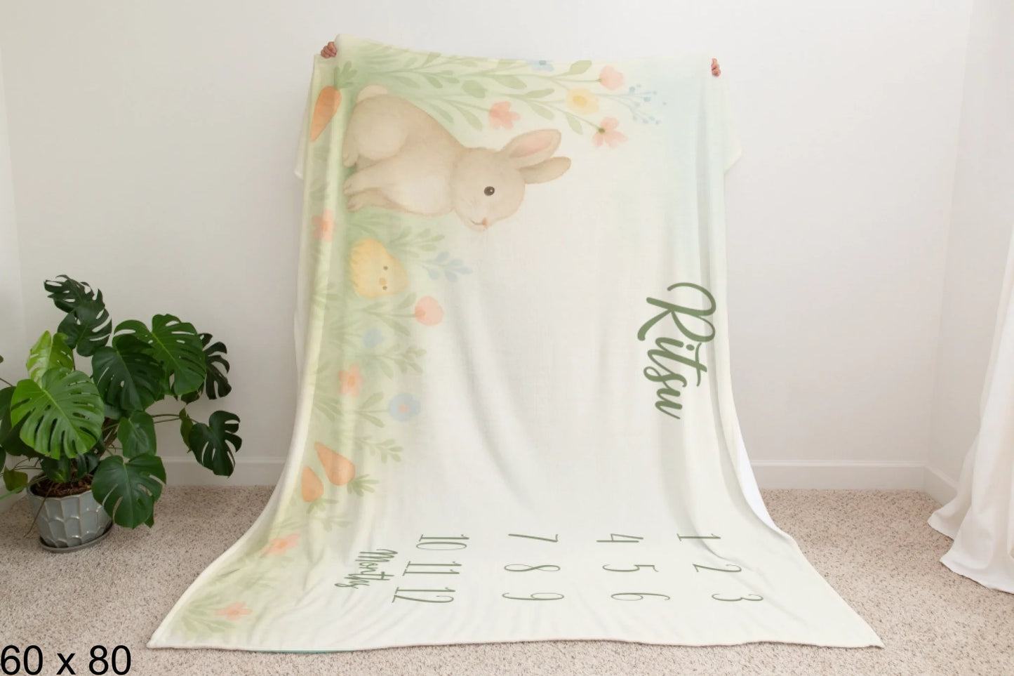 60x80_enchanted_forest_Man_Holding_Velveteen_Blanket_Mockup
