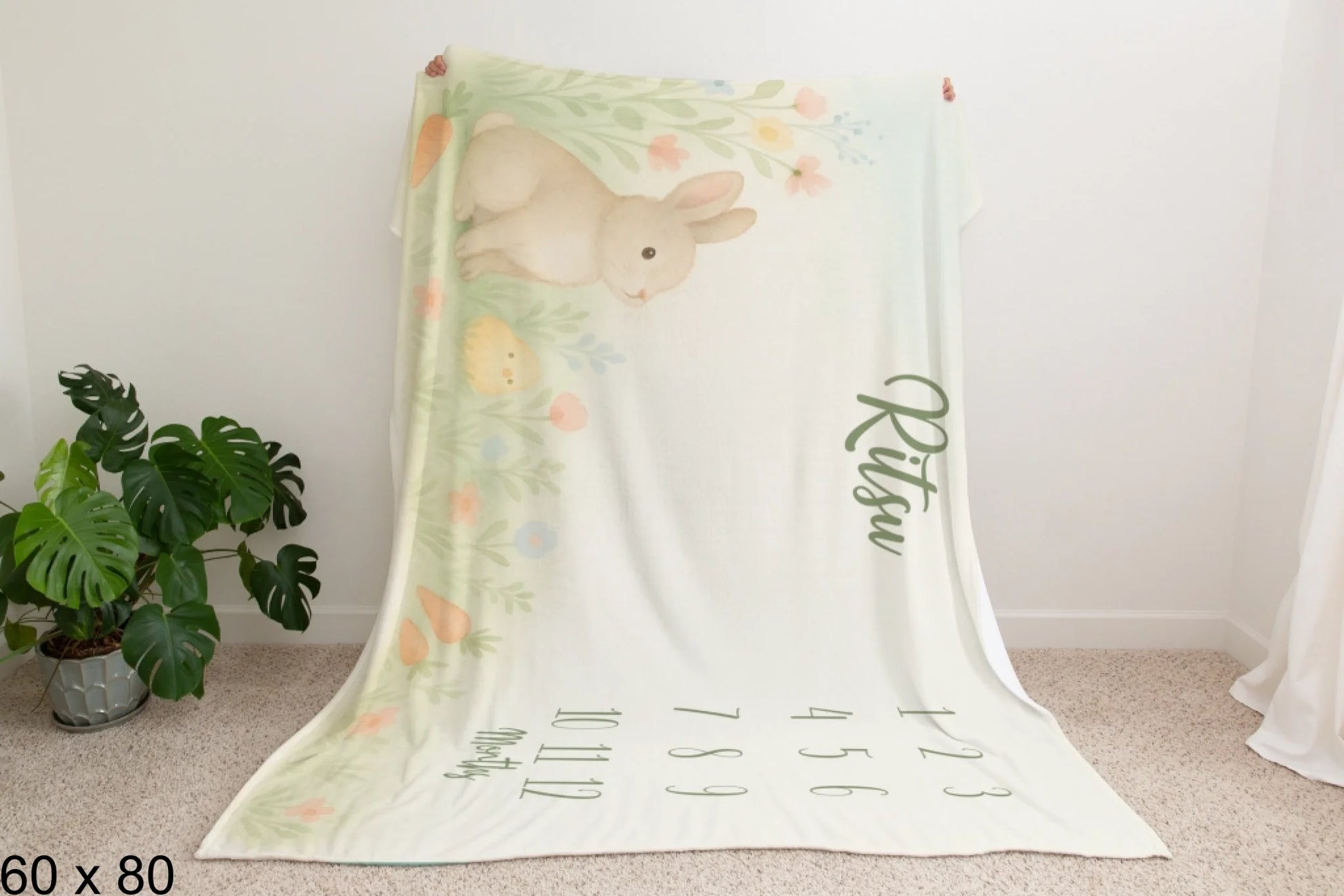 60x80_enchanted_forest_Man_Holding_Velveteen_Blanket_Mockup