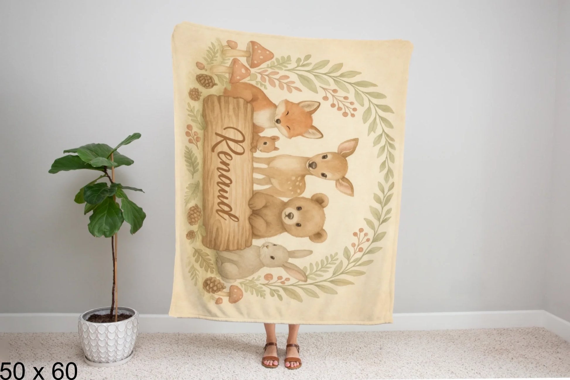 50x60_winter_wonderland_woman_holding_velveteen_blanket_mockup