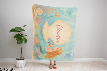 50x60_winter_wonderland_woman_holding_velveteen_blanket_mockup