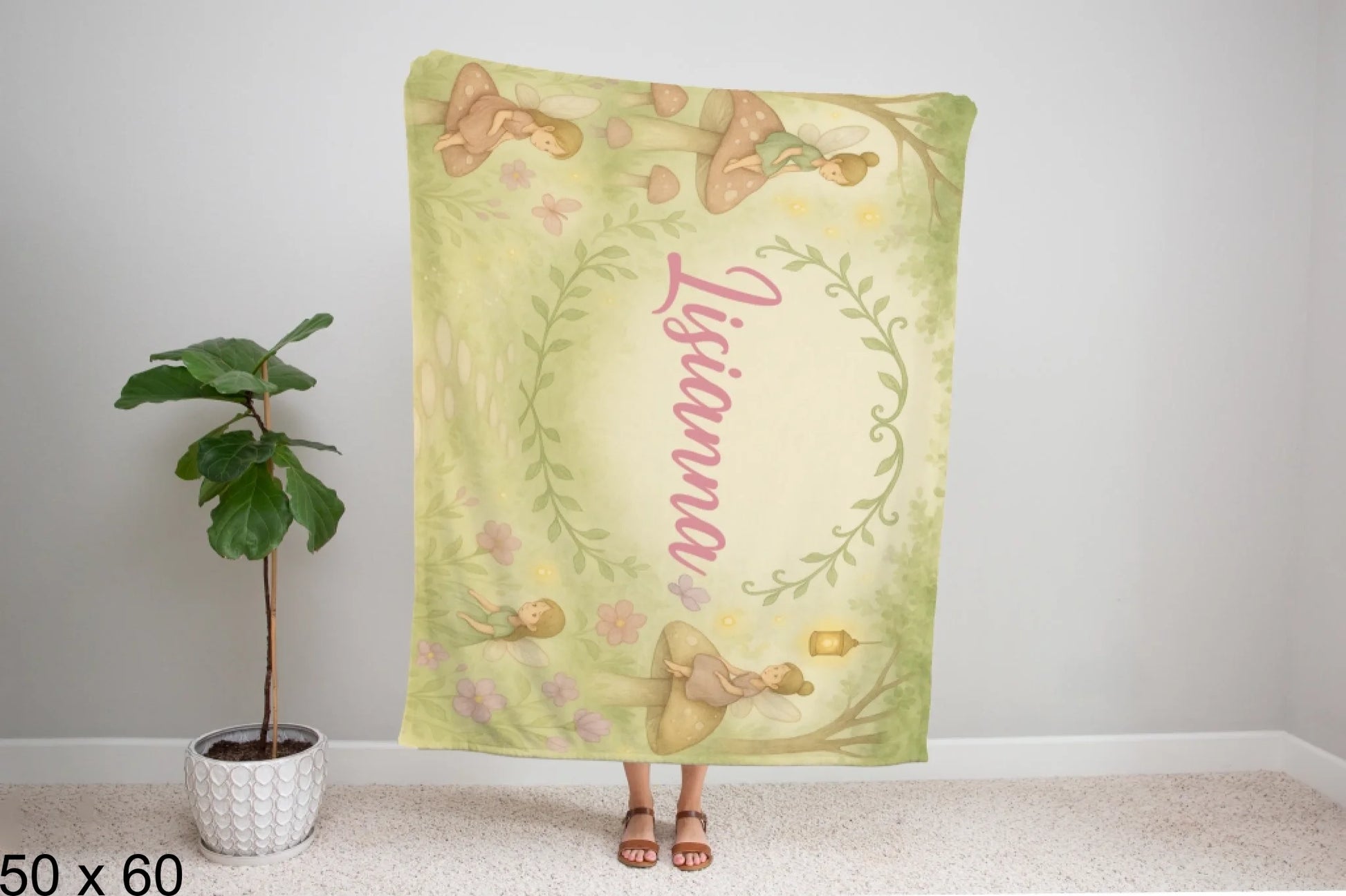 50x60_winter_wonderland_woman_holding_velveteen_blanket_mockup