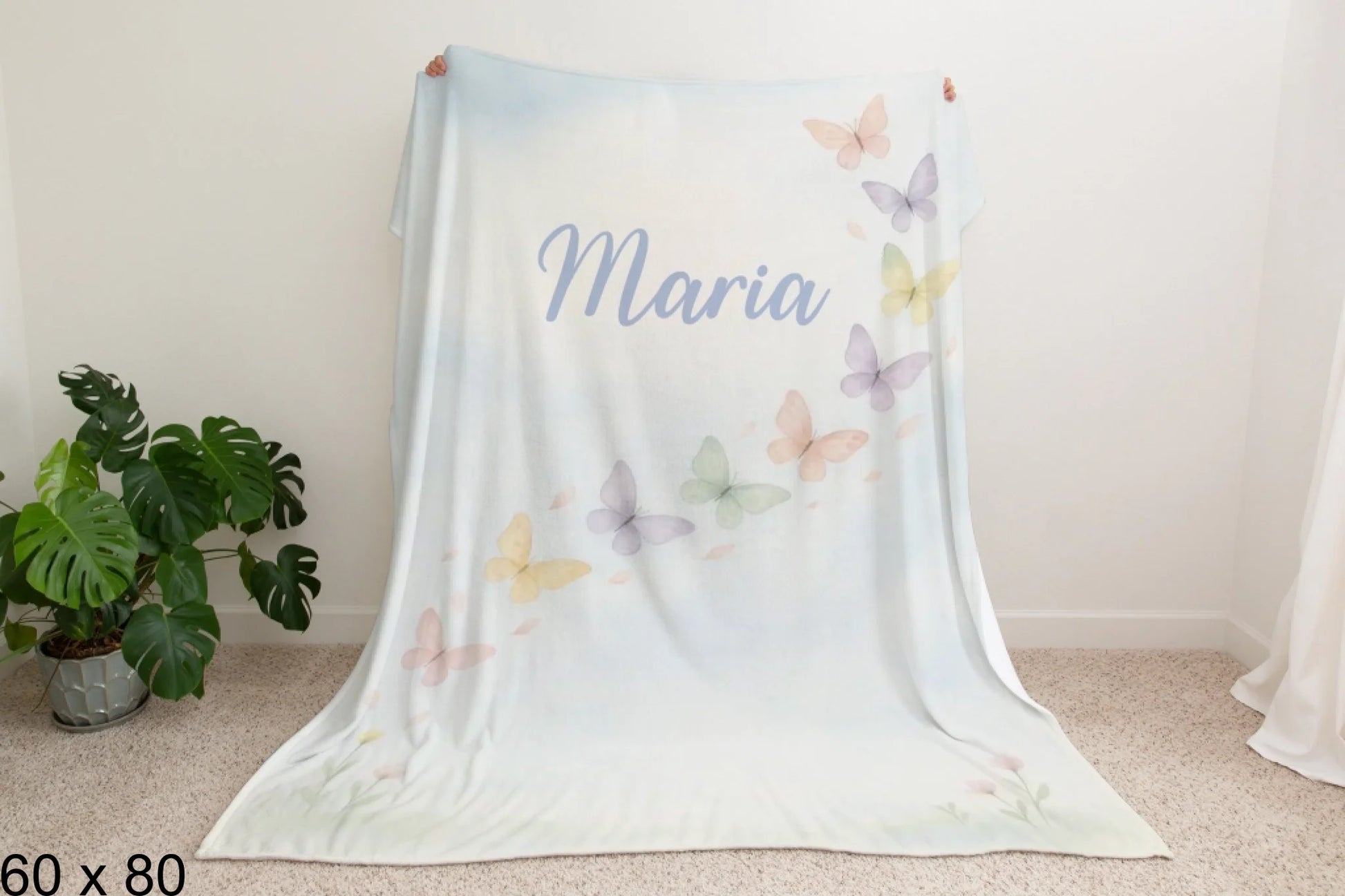 60x80_winter_wonderland_man_holding_velveteen_blanket_mockup