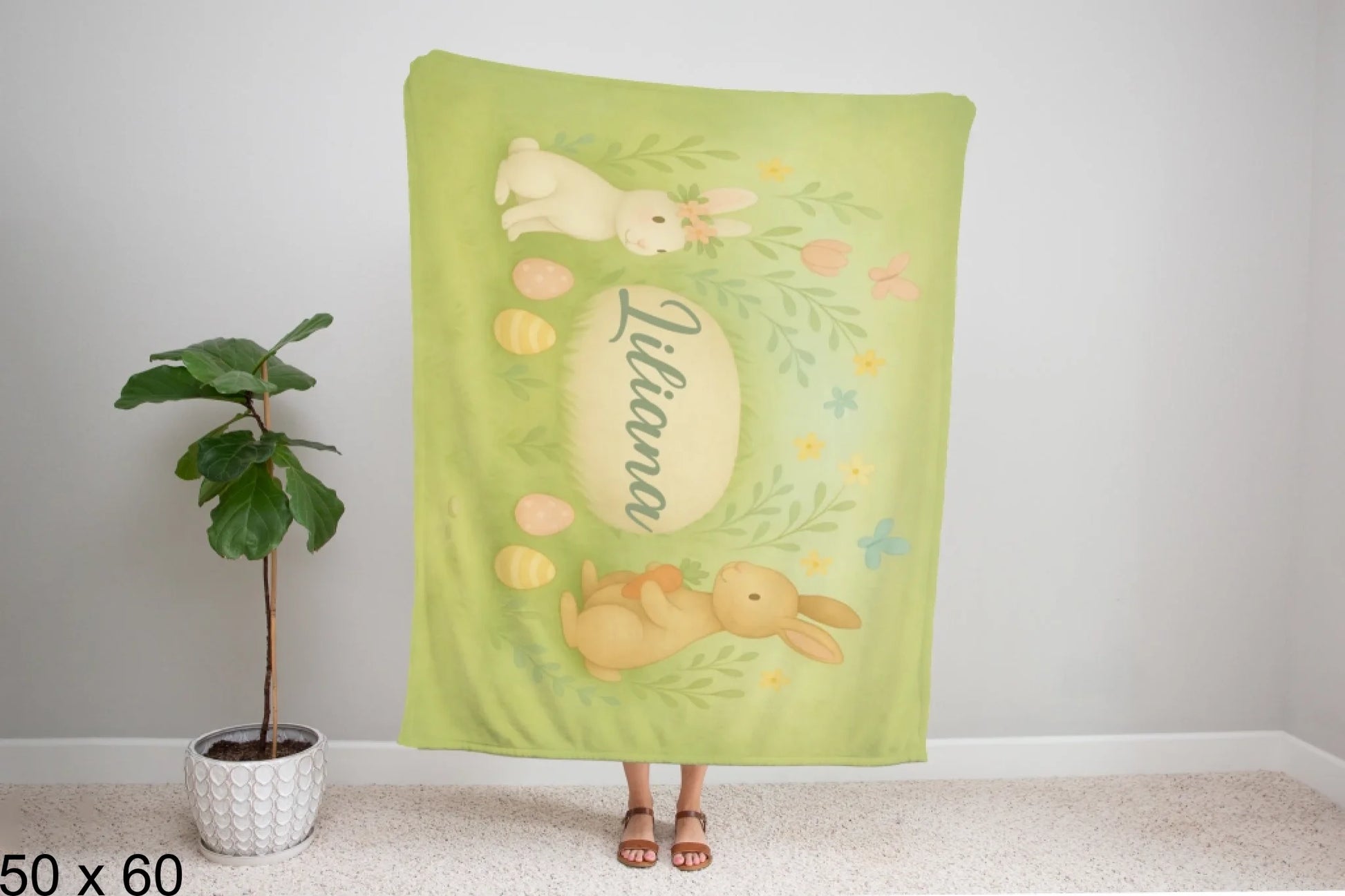 50x60_winter_wonderland_woman_holding_velveteen_blanket_mockup