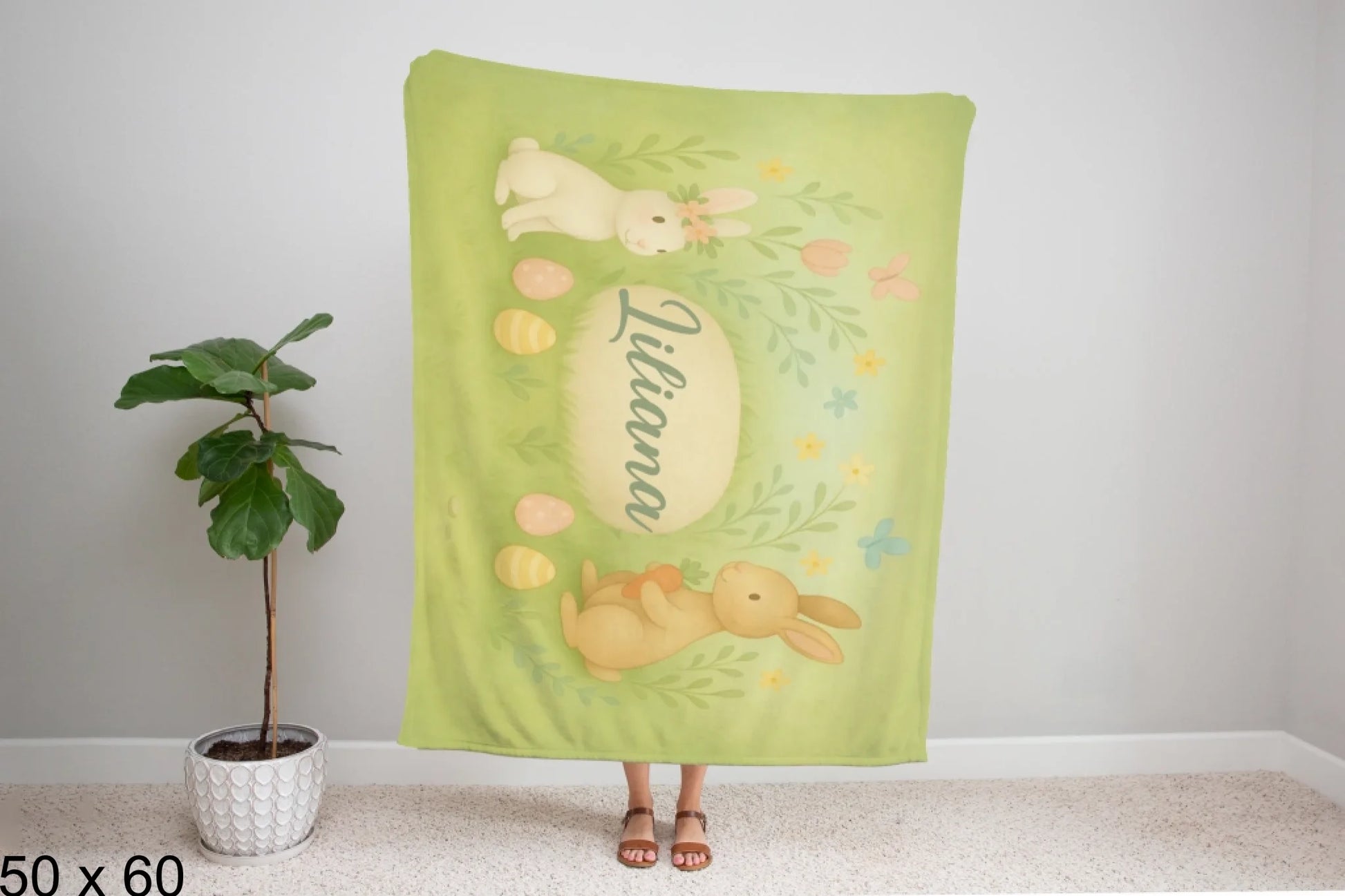 50x60_winter_wonderland_woman_holding_velveteen_blanket_mockup