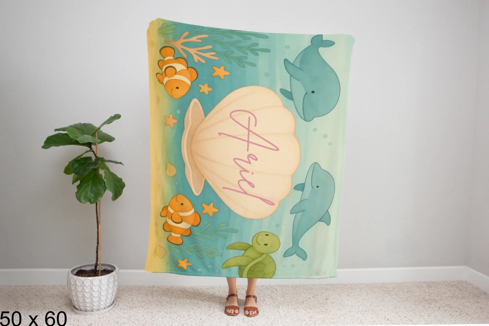 50x60_winter_wonderland_woman_holding_velveteen_blanket_mockup
