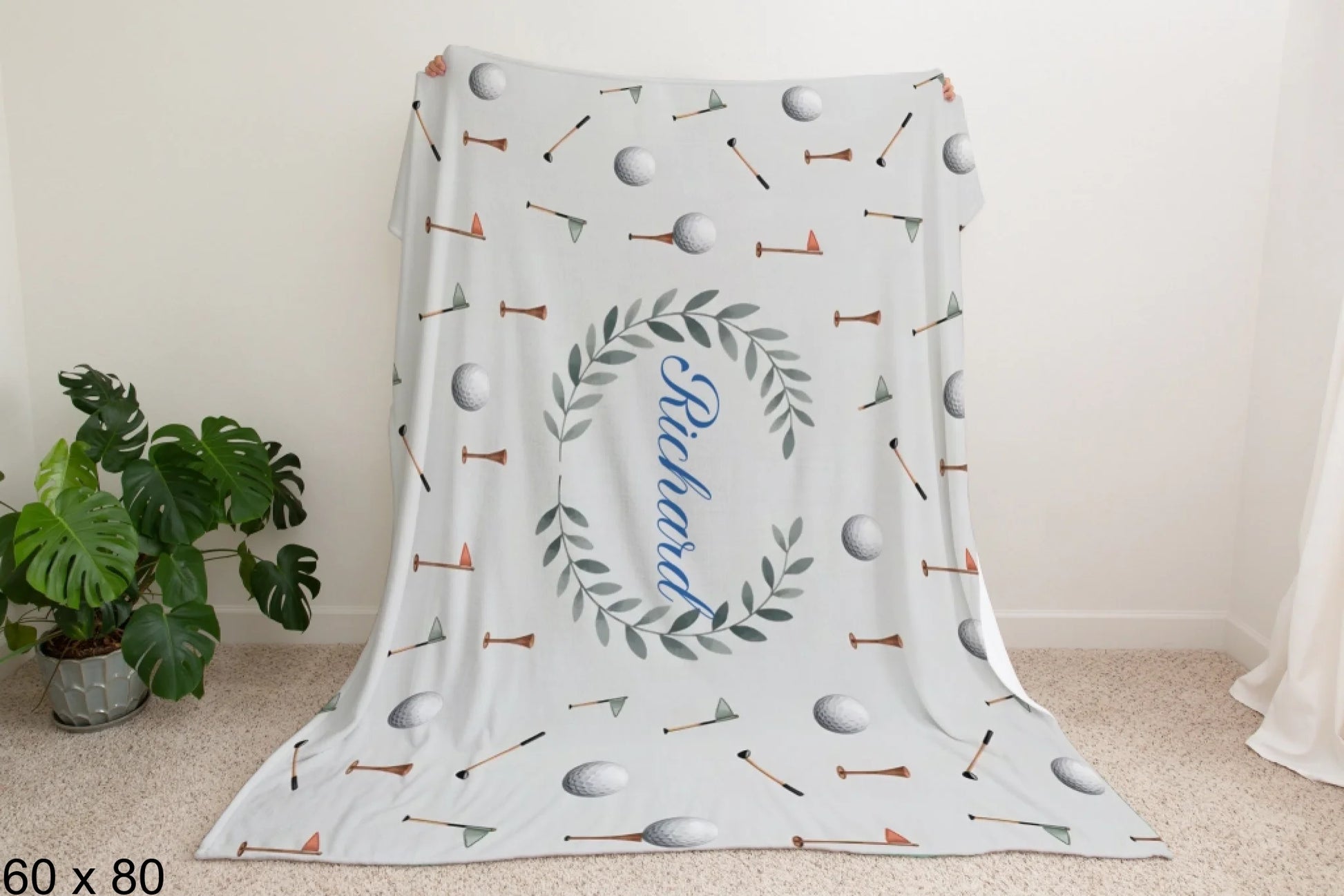 60x80_winter_wonderland_man_holding_velveteen_blanket_mockup