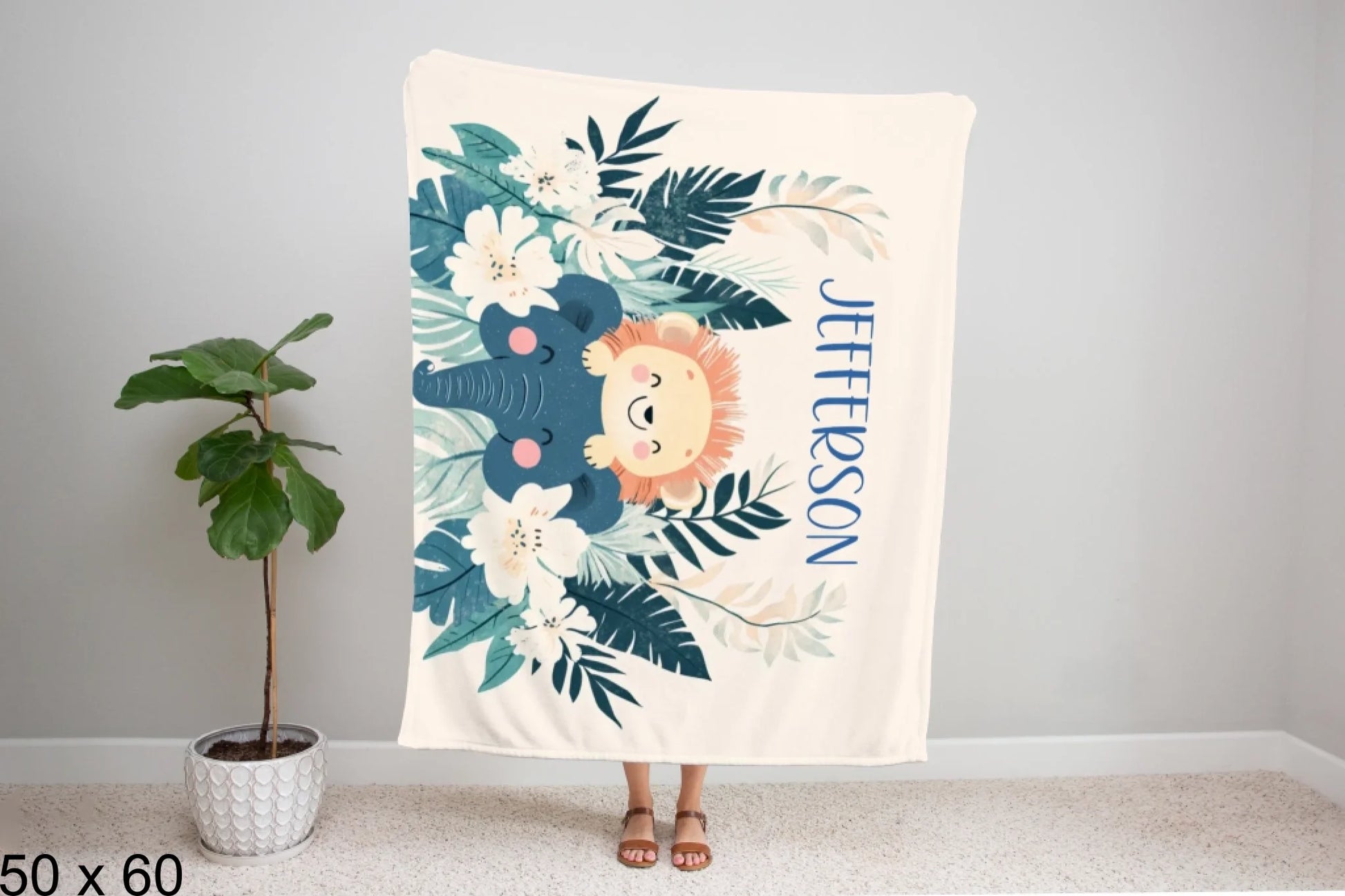 50x60_winter_wonderland_woman_holding_velveteen_blanket_mockup