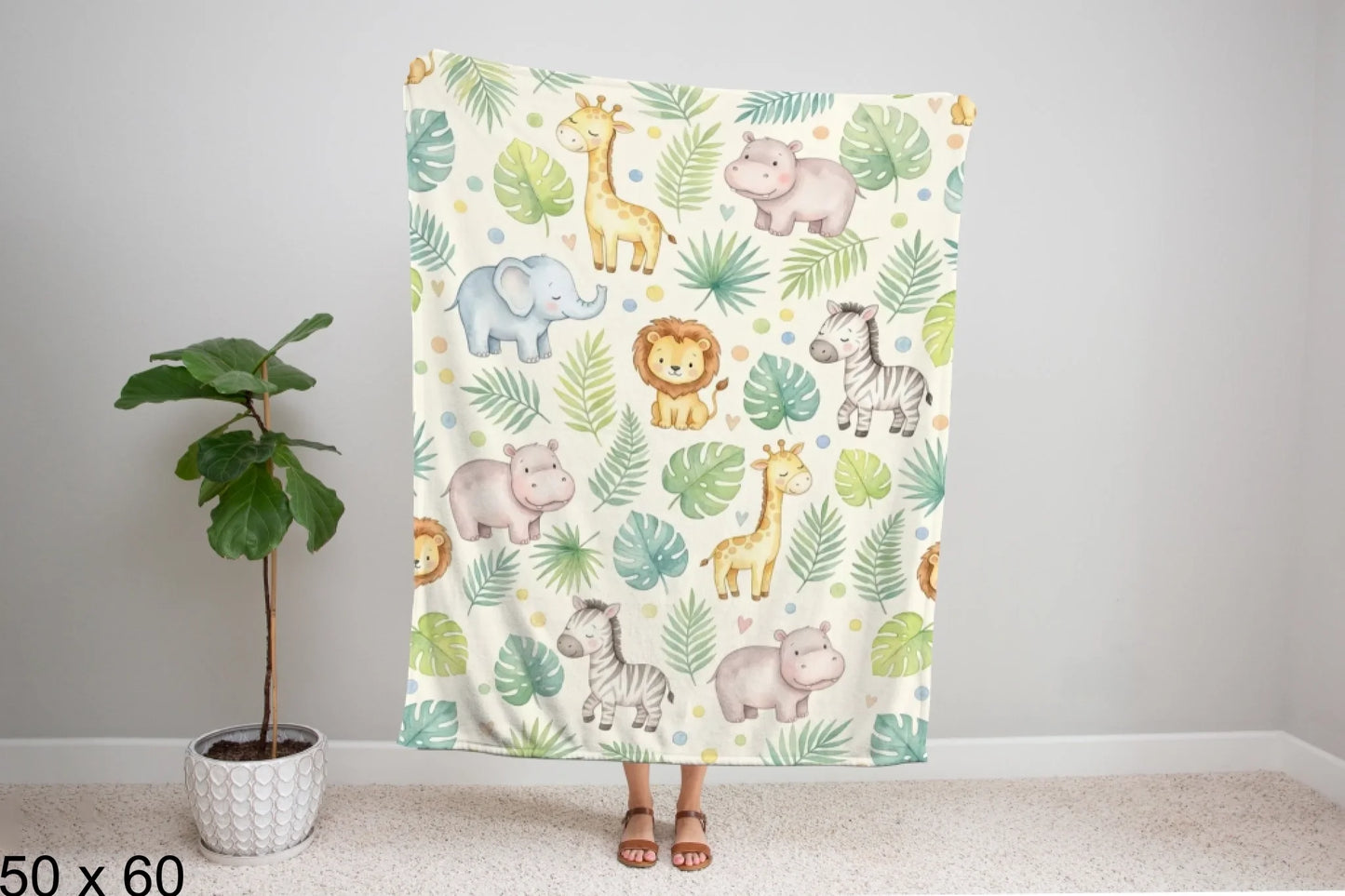 50x60_winter_wonderland_woman_holding_velveteen_blanket_mockup